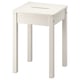 A white, square-topped, solid pine HAUGA stool with a cut-out handle, suitable for extra seating or as a side table.