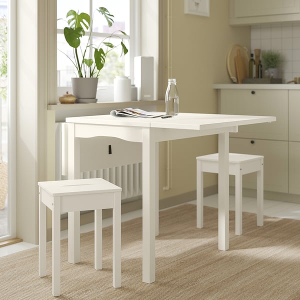 Kitchen with white HAUGA wooden table and stools. Natural, white finish, simple design.