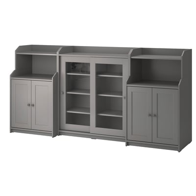 Three-piece gray HAUGA storage set with shelves and cabinet doors, modern design.
