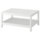 A white HAVSTA coffee table with a sleek design and a lower shelf for storage. Its made of solid pine with clean lines and a brushed surface.