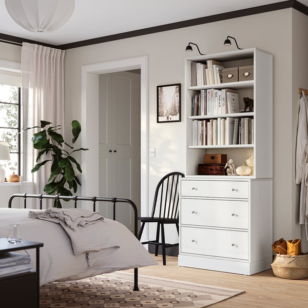 Bedroom with HAVSTA chest & plant, clean minimalist style.
