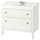 White HEMNES bathroom vanity, featuring 2 drawers with black knobs, a ceramic sink, and chrome faucet.