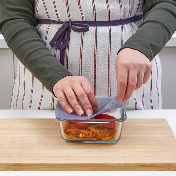 Sealing leftovers in IKEA 365+ glass container with vacuum lid.