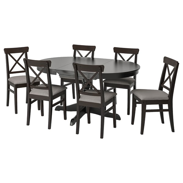 An INGATORP dining set with a dark brown, round, extendable table and six matching chairs with gray cushions.