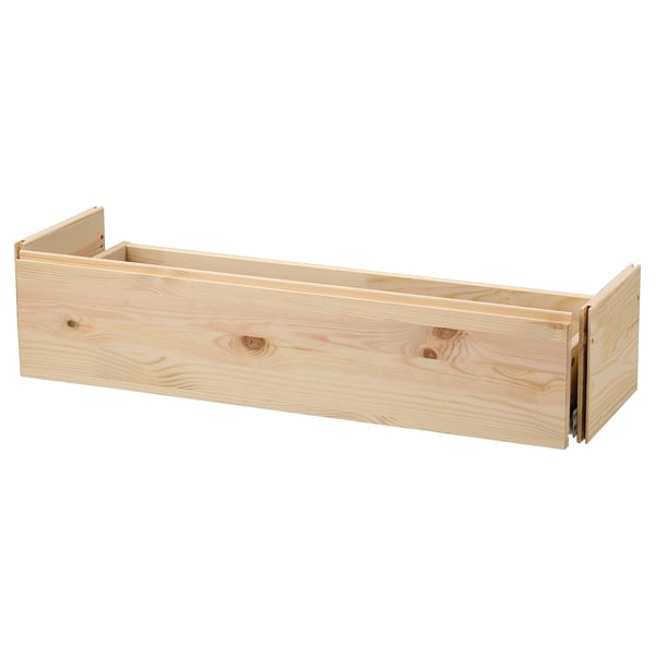A light wood IVAR drawer. Its simple, rectangular, and made of solid pine.
