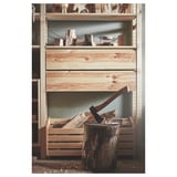 IVAR storage shelves in natural wood with axe and chopped logs.