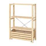 An IVAR light wood storage unit with two shelves and a crated bottom on wheels. Its simple, practical, and mobile.