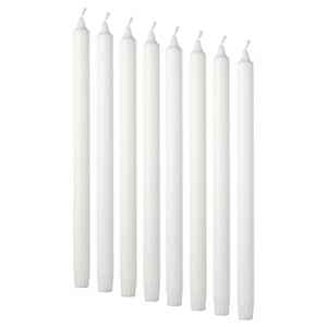 Eight white candles. Simple, cylindrical shape with cotton wicks. Arranged in pairs, standing upright.