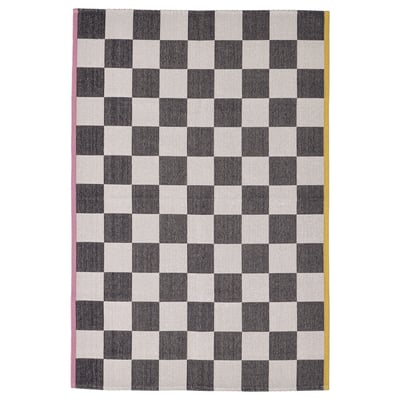 KLASSRUM rug: black & white checkerboard, pink & yellow sides, rectangular, flat-woven cotton & polypropylene.