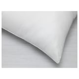 Closeup of quality microfiber pillow showing smooth fabric and stitching detail.