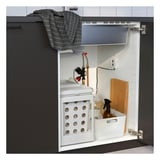 Under-sink dishwasher unit with remote control, alarm sensor, and storage basket.