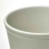 Close-up of a sleek, high-quality light green plant pots rim and interior.
