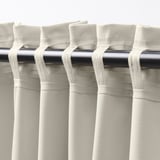Beige KORGMOTT block-out curtains with dense fabric and multi-way header.