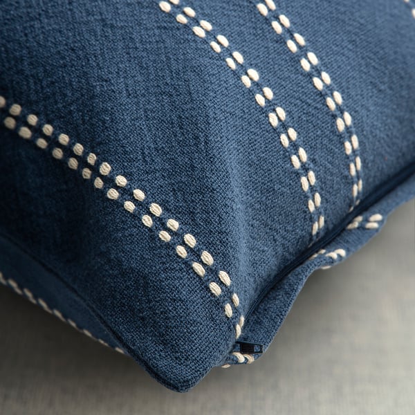 Blue cushion cover with white dobby stripe pattern, zipper closure.