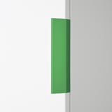 Green LÄTTHET handle, slim, minimalist, attaches anywhere; shown large, covers 1/3 wall height.