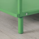 Bright green metal furniture leg with adjustable foot, ensuring stability on uneven floors.