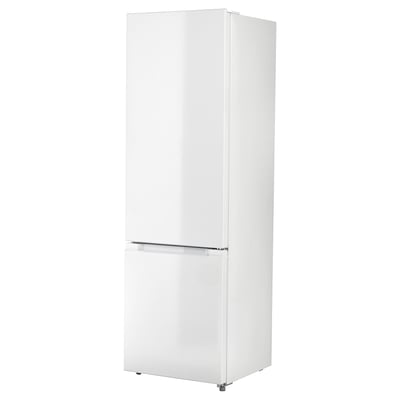 White upright fridge-freezer with seamless design and transparent drawer at the bottom.