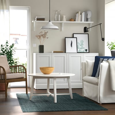 Cozy living room with LANDBANA jute rug, coffee table, and minimalist decor.