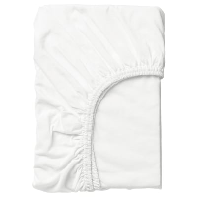 Folded white sustainable cotton sheet, elastic for secure fit.