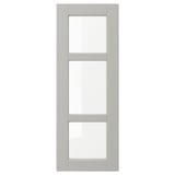 A grey LERHYTTAN kitchen cabinet door with beveled wooden frame and clear glass panels.