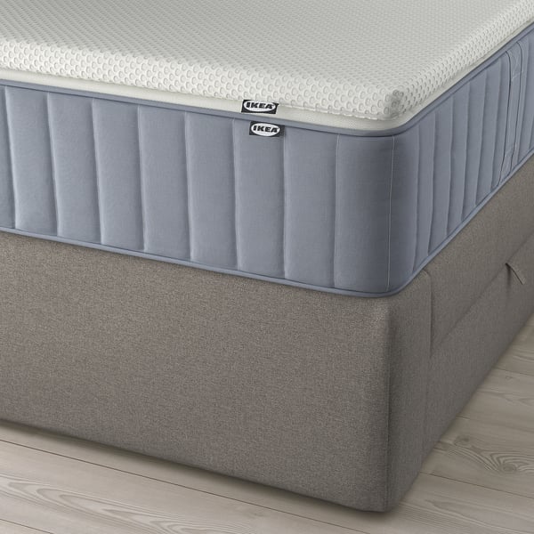 IKEA LILLFJÄLLET divan bed with sloped headboard, removable cushions, and under-bed storage, shown with mattress.