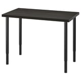 A LINNMON modern adjustable desk with a dark top and metal legs in black.
