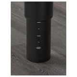 Black adjustable table leg on dark wooden floor; marked measurements from 60 to 90 cm.