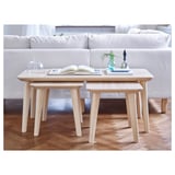 Three LISABO coffee tables with slanted legs in living room.