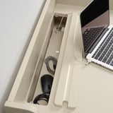 Desk with built-in cable management, keeping cables organized and out of sight.