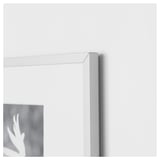 Close-up of a sleek, silver picture frame corner with thin metal edge, showcasing its high-quality design.