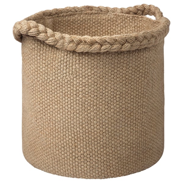 A MÄVINN jute basket in natural beige. It’s hand-woven with sturdy handles and a braided rim, perfect for storage and home decoration.