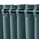 Dark curtains, looped rod pockets, black rod, room darkening, pleated design.