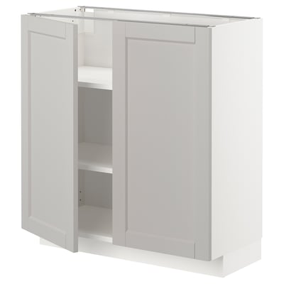 White METOD kitchen cabinet with beveled edges, adjustable shelves.