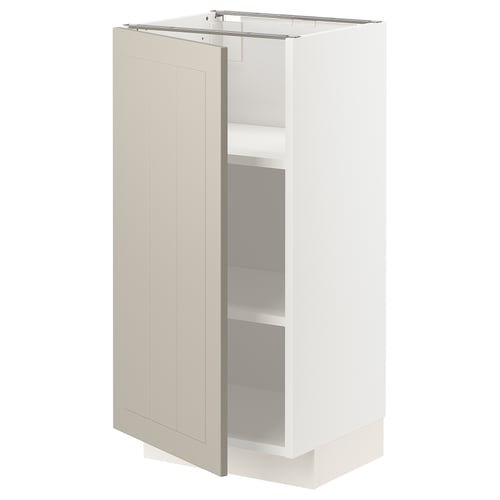 A cream-colored kitchen cabinet with one door open, revealing adjustable shelves inside.