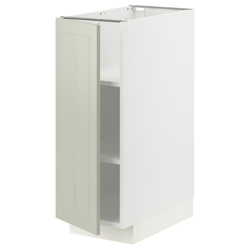 A white METOD kitchen cabinet with a green stensund door. Its rectangular with adjustable shelves and a sleek, modern design.