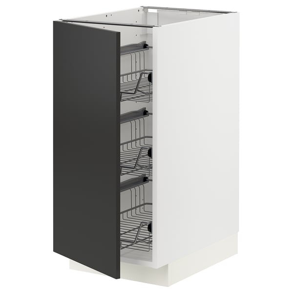 Modern kitchen cabinet, white with black door, wire baskets.