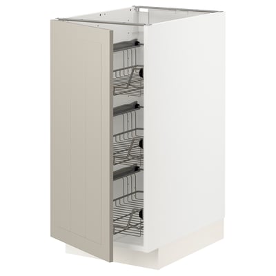 A white METOD kitchen cabinet with beige stensund fronts, featuring multiple pull-out wire baskets for storage.