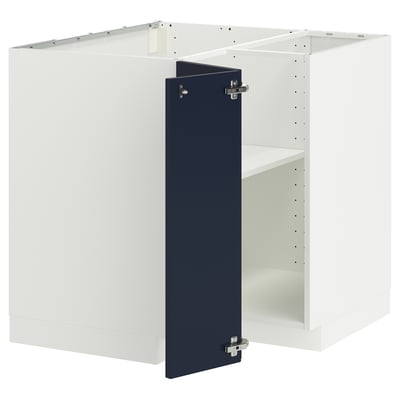 A white METOD kitchen cabinet with a blue door. It has a modern design with a square shape and hinge details.