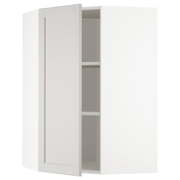 White wall-mounted corner cabinet from ikeas METOD kitchen system, featuring light grey lerhyttan fronts with bevelled edges for a classic look.
