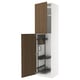 A white METOD kitchen cabinet with wooden walnut doors, one open. It pull-out organizers and is designed for storing cleaning supplies.