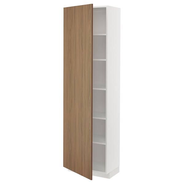 A white METOD kitchen cabinet with a single door partially open, revealing adjustable shelves. The door a modern walnut look.