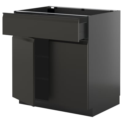Modern black kitchen unit, METOD, with sleek drawer and smooth cabinet, glossy finish.