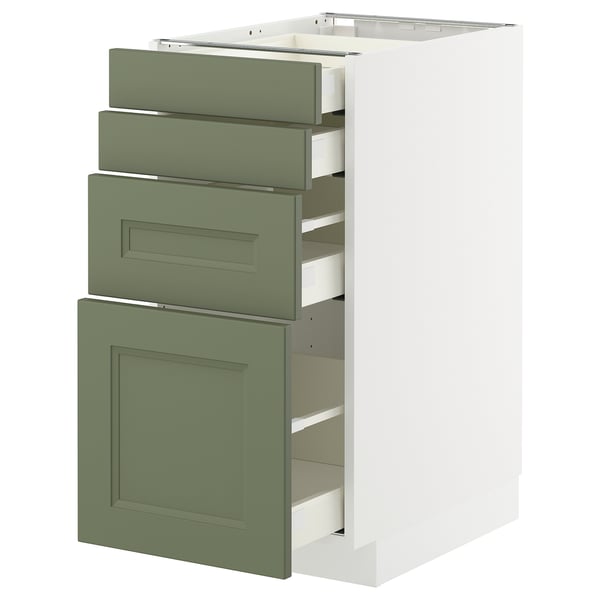 Modern kitchen unit with green drawers and white base. Three pullout drawers and a larger cabinet door.