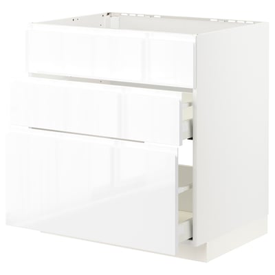 White METOD kitchen cabinet with glossy finish & integrated handles.