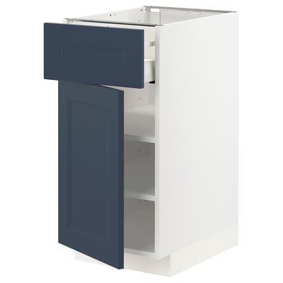White and blue kitchen cabinet with open drawers. Modern, rectangular shape with a sleek design.