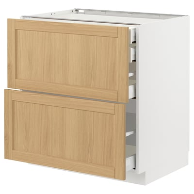 Wooden METOD kitchen cabinet with oak veneer drawers, white sides, beige handles, rectangular design, and smooth finish.