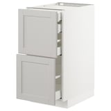White METOD kitchen cabinet with bevelled light gray lerhyttan drawer fronts.