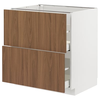 White METOD kitchen cabinet with sleek, dark wood effect drawers and clean edges.