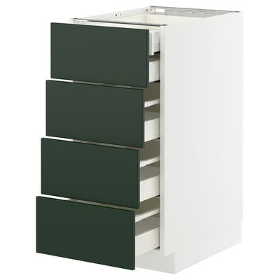 White kitchen cabinet with four dark green drawers.