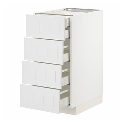 White METOD kitchen unit with four partially open drawers, sleek and modern design.